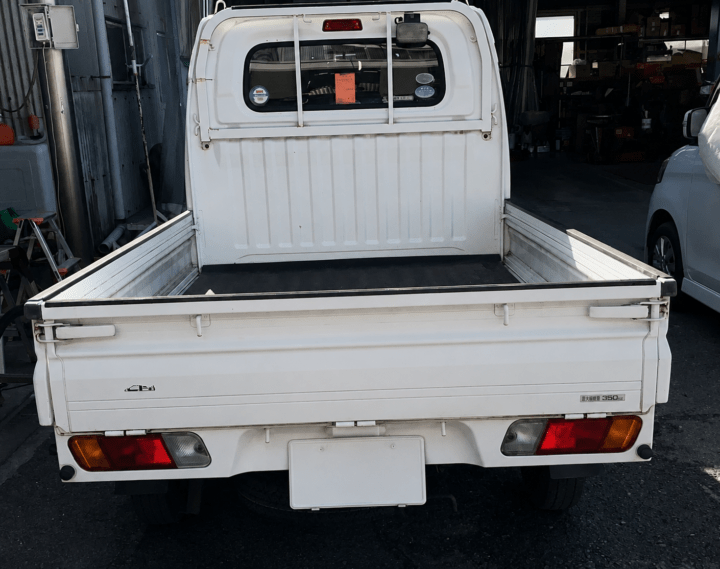 305d64cc-630f-4662-a4d0-64e7a206047d - 鈑金塗装・カーコーティング・車検|山口県周南市 東洋ボデー株式会社 ミツビシ ミニキャブトラック 車検整備 リアビュー